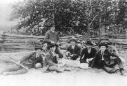 Drinking and Playing cards by a rail fence in about 1910.